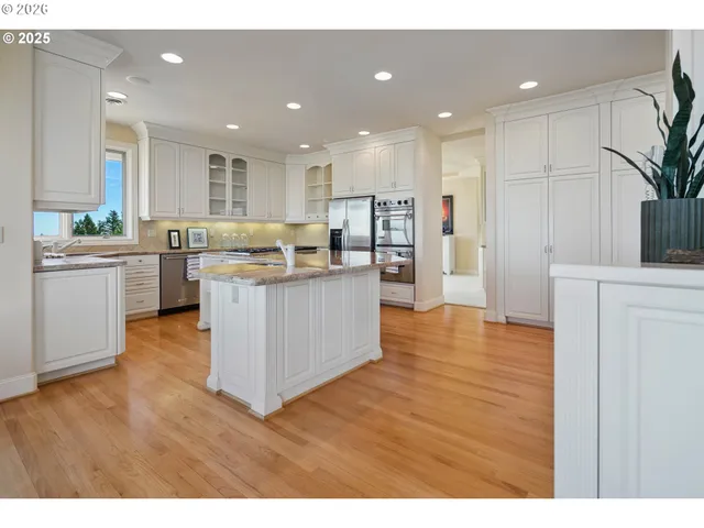 a kitchen with lots of counter top space and furniture