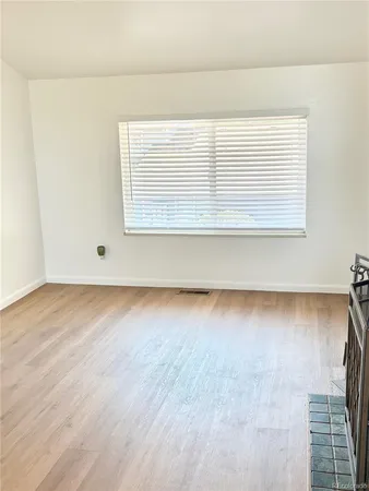 a view of kitchen and empty room