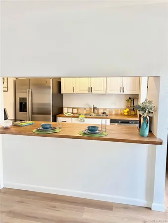 a view of a room with wooden floor