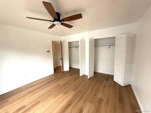 a view of an empty room and wooden floor
