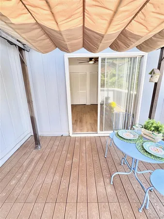 a view of a chairs and table in patio