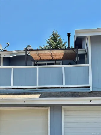 a view of a kitchen with wooden cabinet and a stove top oven