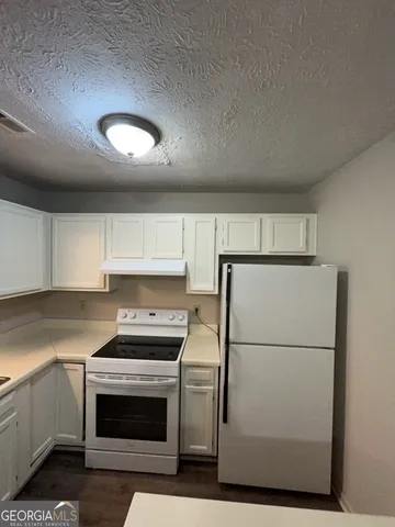 a close view of sink and washing machine