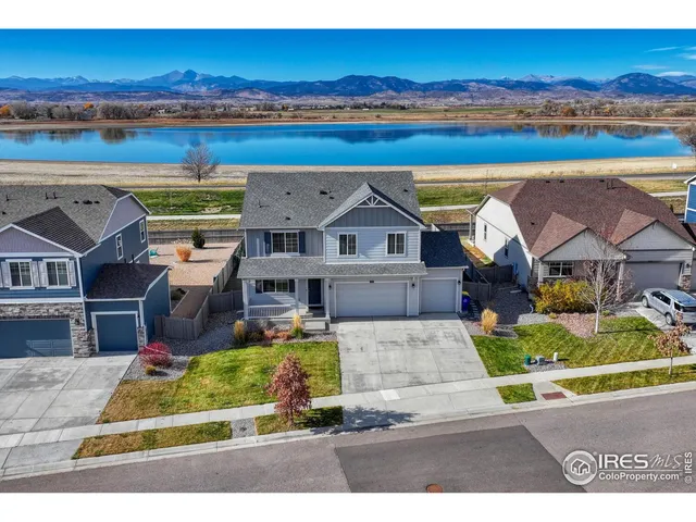 an aerial view of a house with a ocean view