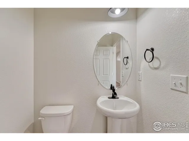 a view of a kitchen with a sink stainless steel appliances and cabinets