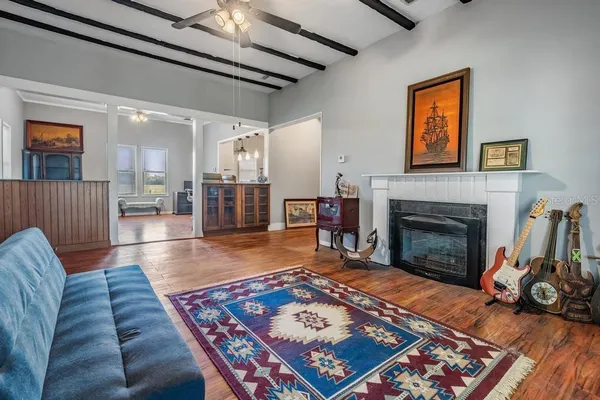 a living room with furniture and a fireplace