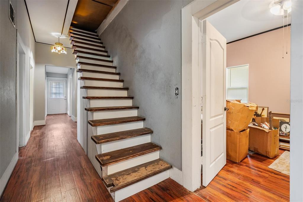 7207 Elwood Road Zephyrhills, FL 33540 - Photo 22 of 23 a view of entryway and hall with wooden floor