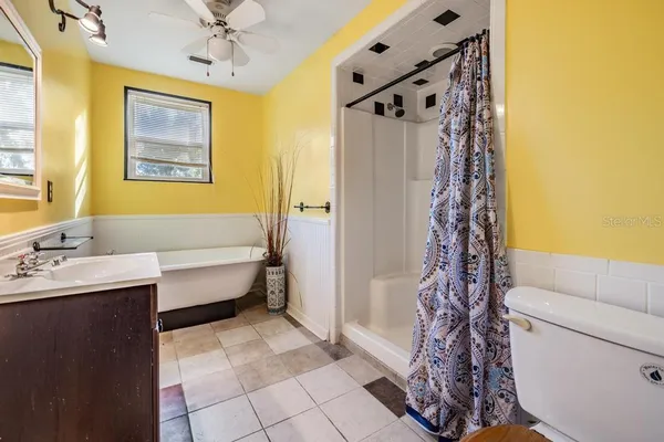 a bathroom with a bathtub and shower