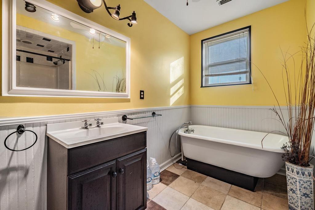 7207 Elwood Road Zephyrhills, FL 33540 - Photo 8 of 23 a bathroom with a sink and a mirror