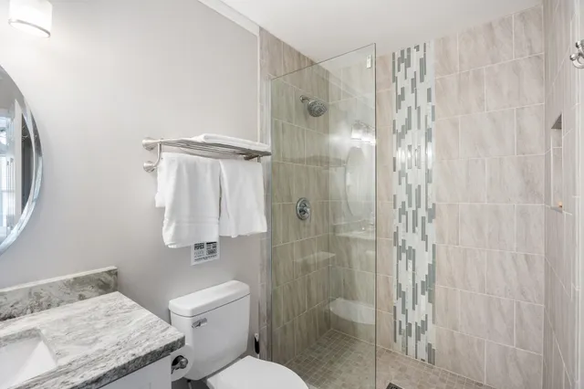 a bedroom with furniture and wooden floor