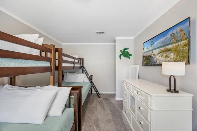 a bedroom with a bed and cabinets