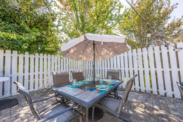 a balcony with furniture and wooden floor