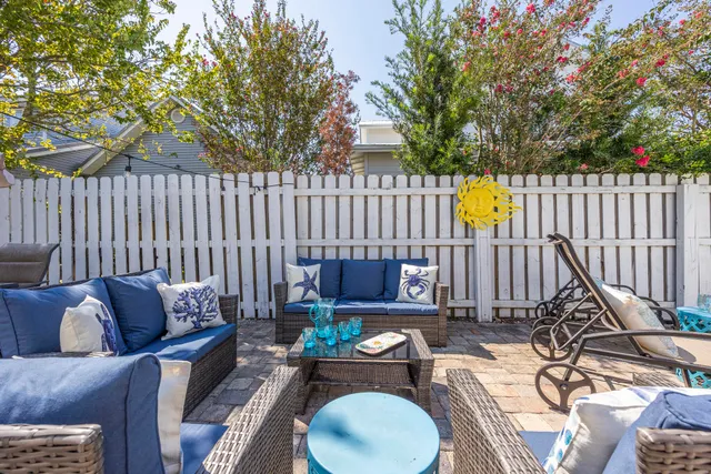 a view of a swimming pool with a patio and a swimming pool