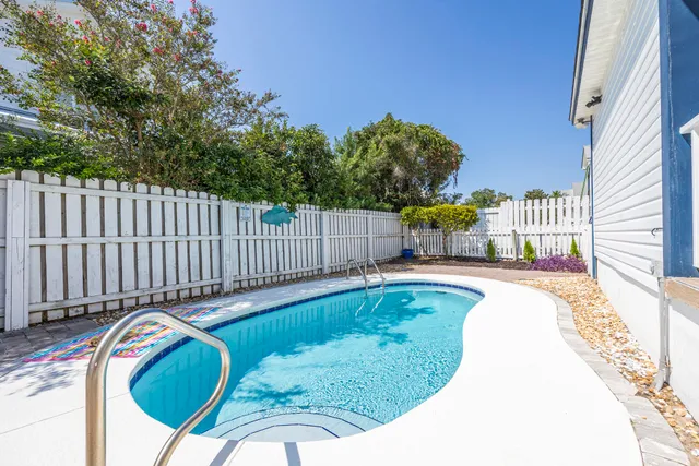 a view of a swimming pool with a sitting space