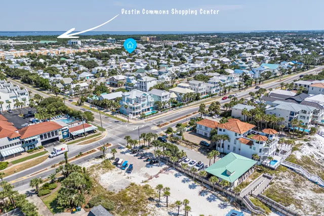 a view of a street with potted plants