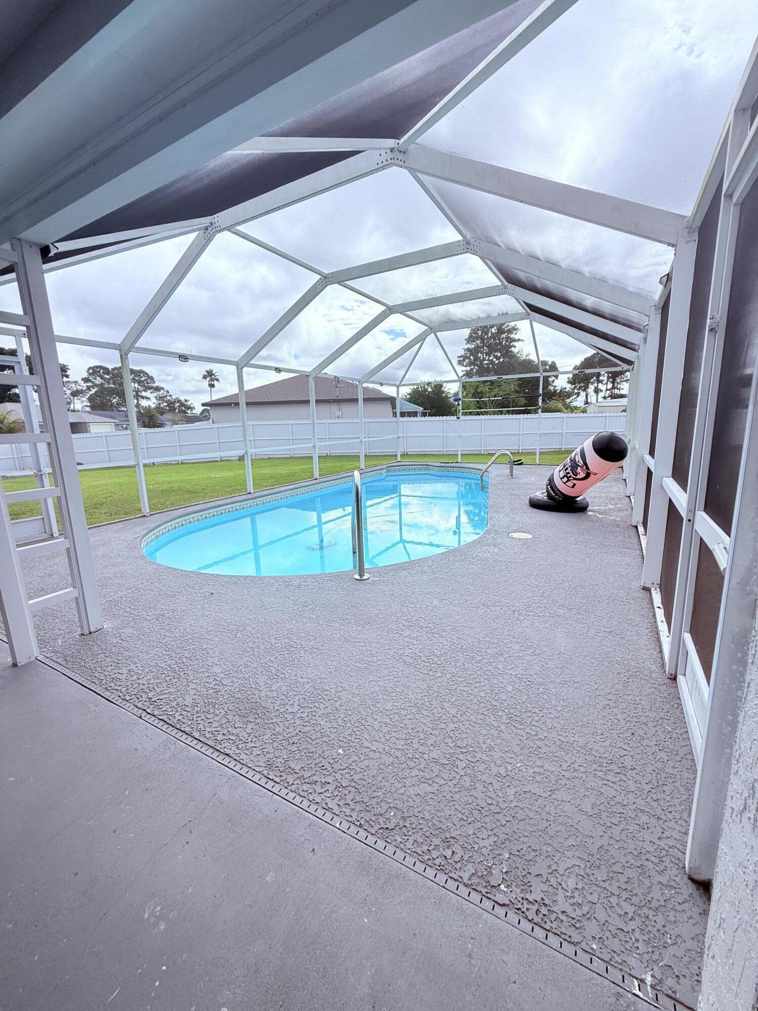 302 Southwest Whitmore Drive Port St. Lucie, FL 34984 - Photo 17 of 21 a view of an outdoor space and deck