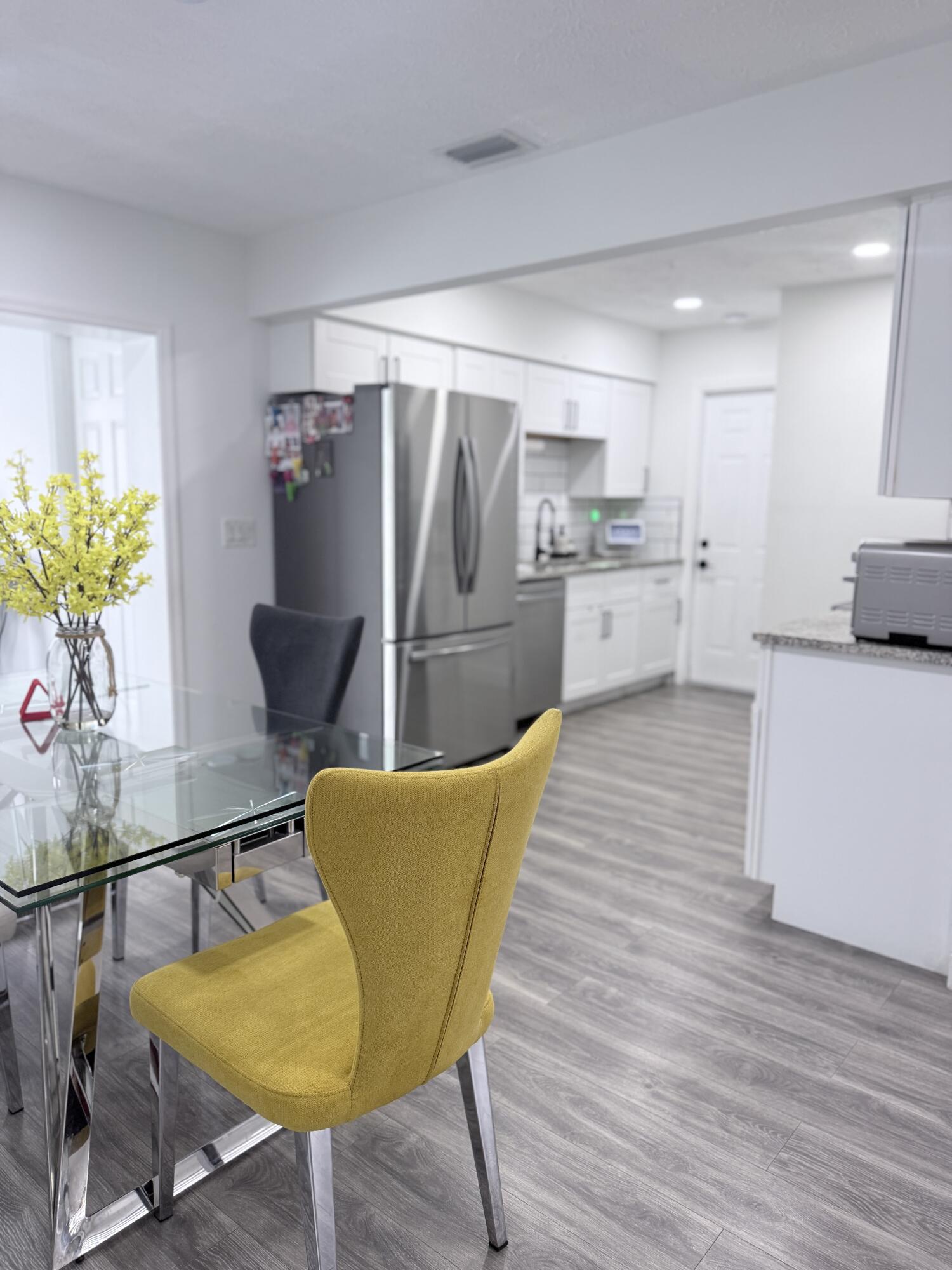 302 Southwest Whitmore Drive Port St. Lucie, FL 34984 - Photo 5 of 21 a living room with stainless steel appliances furniture and a kitchen view