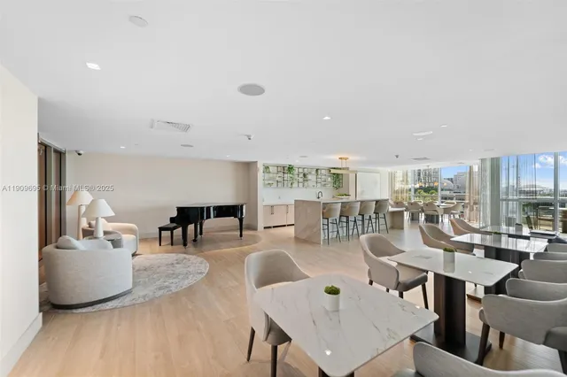 a living room with lots of furniture and a table