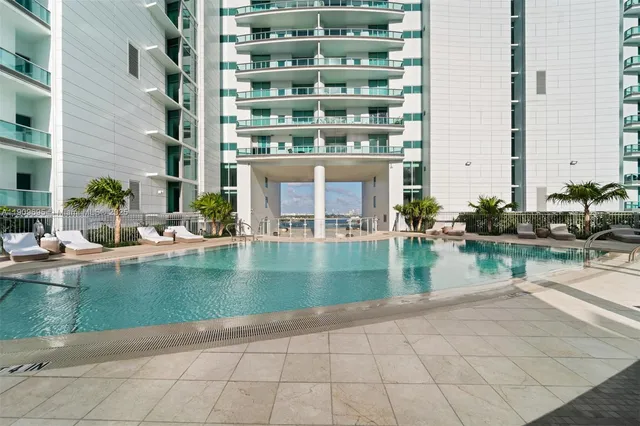 a view of pool with outdoor seating