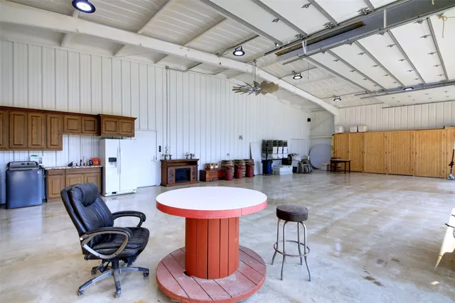 a kitchen with a dining table and chairs