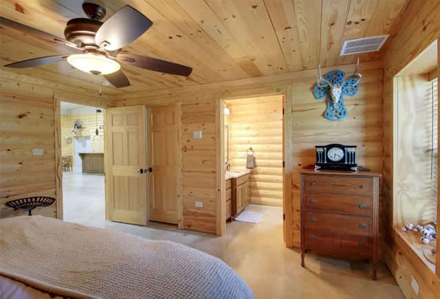 a bedroom with a bed and a dresser