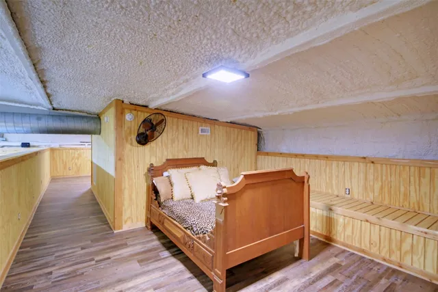 a large kitchen with a table and chairs