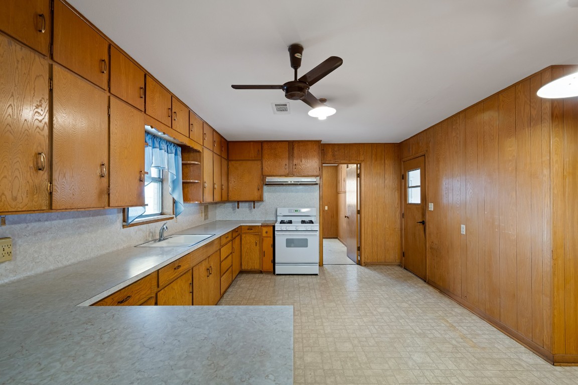 314 County Road 233 Wharton, TX 77488 - Photo 11 of 36 a kitchen with stainless steel appliances granite countertop a sink and cabinets