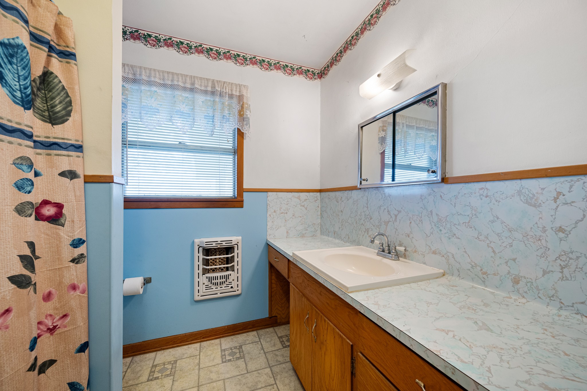 314 County Road 233 Wharton, TX 77488 - Photo 25 of 36 a bathroom with a sink and a mirror