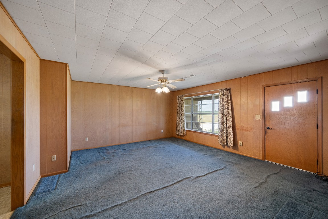 314 County Road 233 Wharton, TX 77488 - Photo 6 of 36 an empty room with chandelier fan and windows