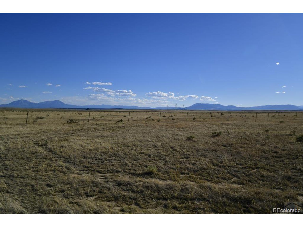 a view of an ocean and a mountain