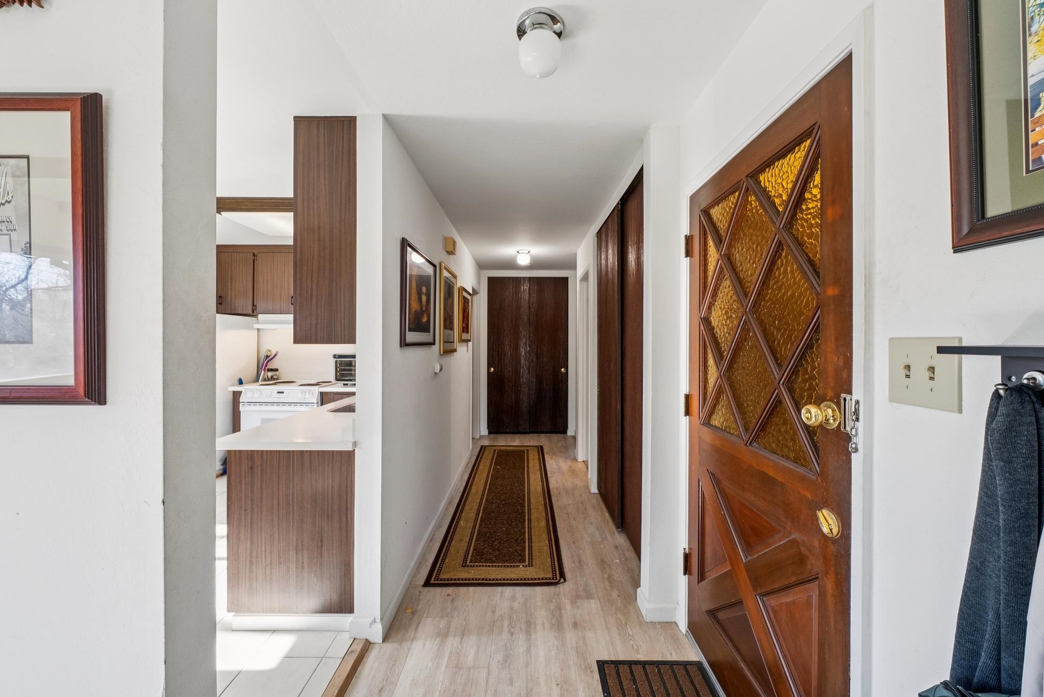 1401 Cottage Street, Unit D Alameda, CA 94501 - Photo 12 of 25 a view of a hallway with wooden floor and a living room
