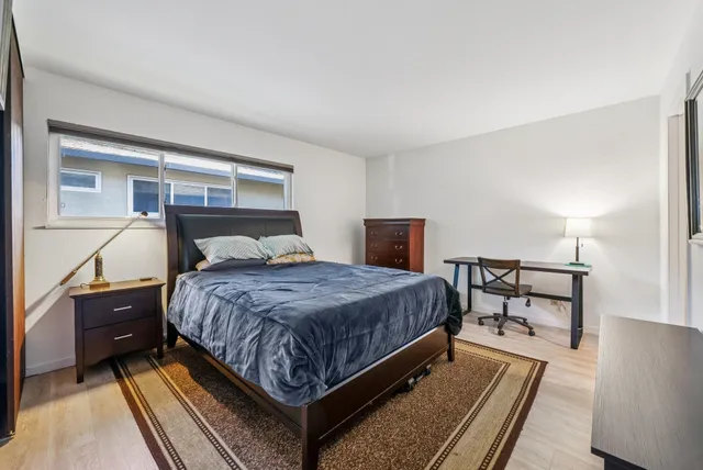 a bedroom with a bed and window