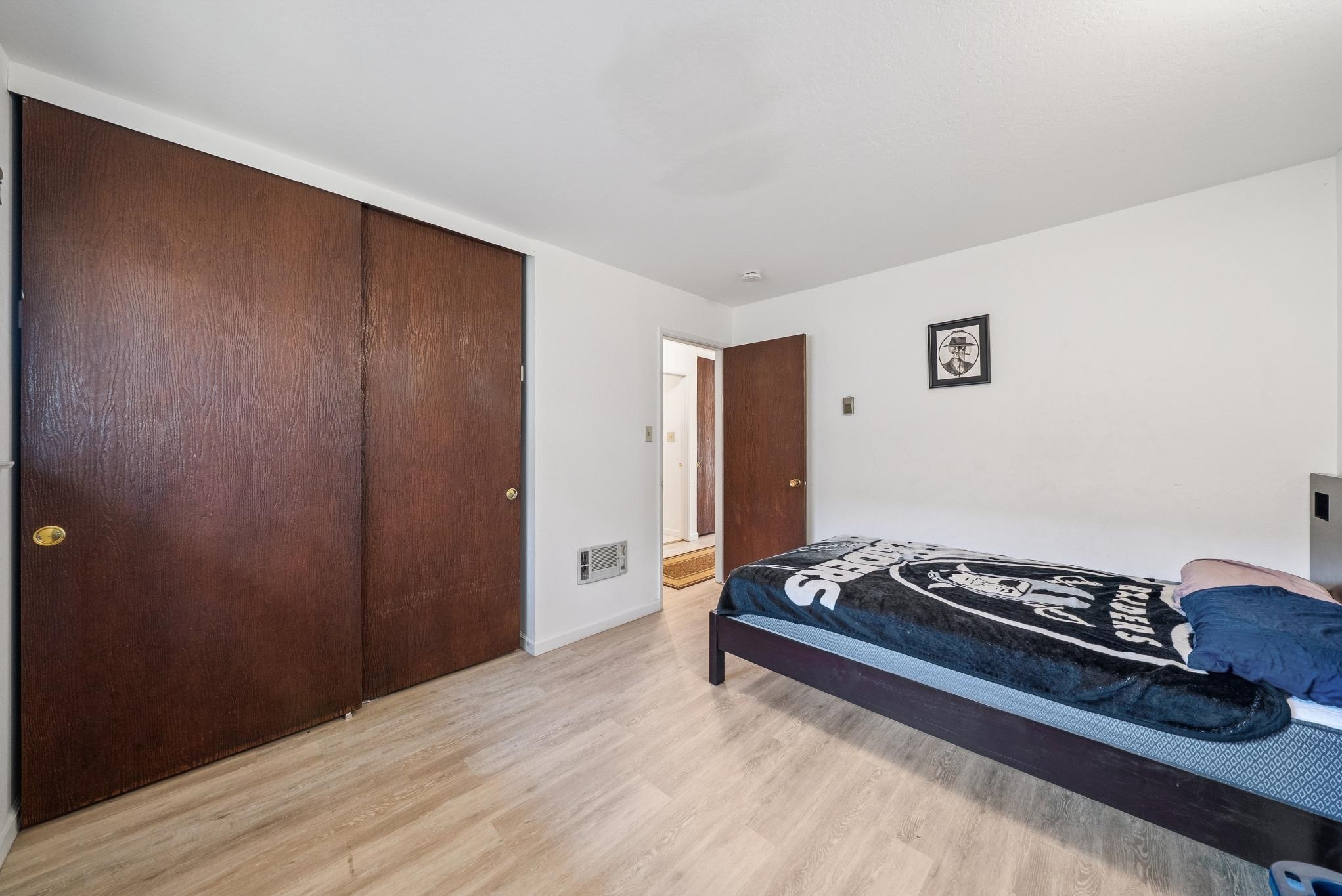 1401 Cottage Street, Unit D Alameda, CA 94501 - Photo 18 of 25 a living room with furniture and a wooden floor
