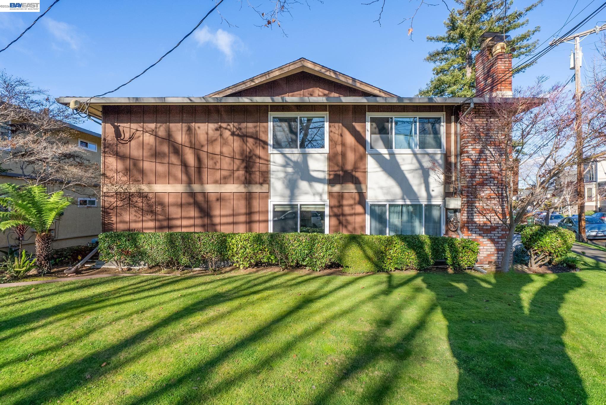 1401 Cottage Street, Unit D Alameda, CA 94501 - Photo 18 of 25 a front view of a house with a yard