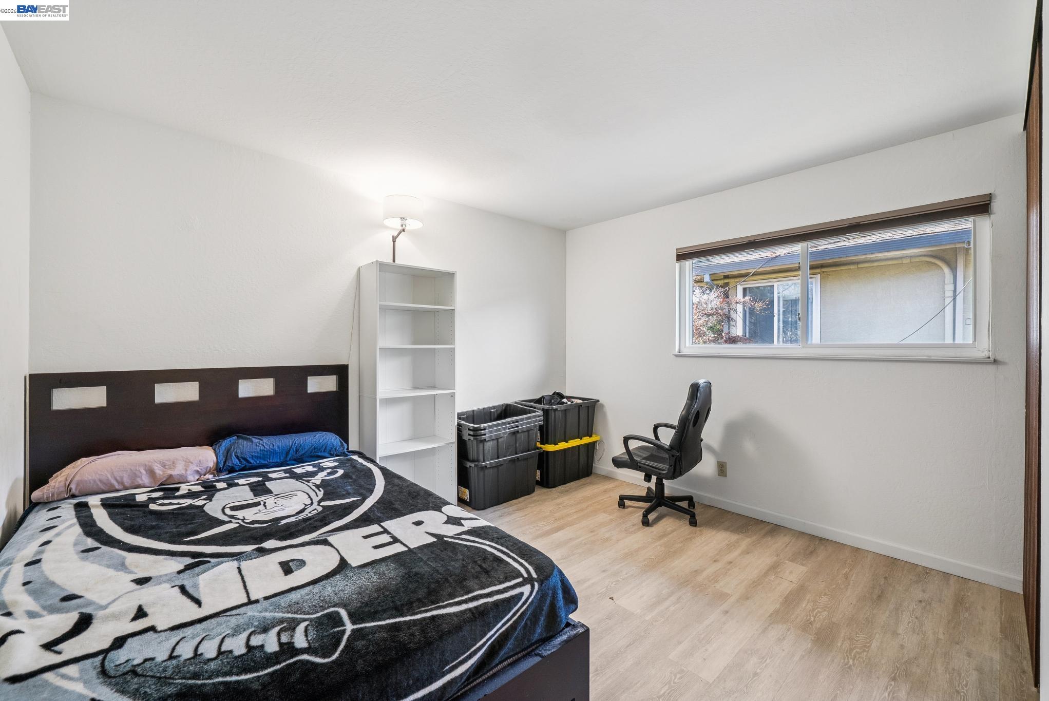 1401 Cottage Street, Unit D Alameda, CA 94501 - Photo 20 of 25 a living room with furniture and a wooden floor