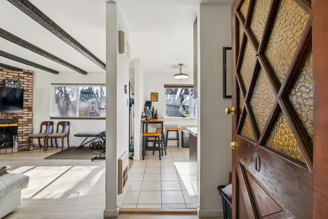 a view of living room with furniture and large window