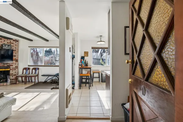 wooden floor with a view of living room