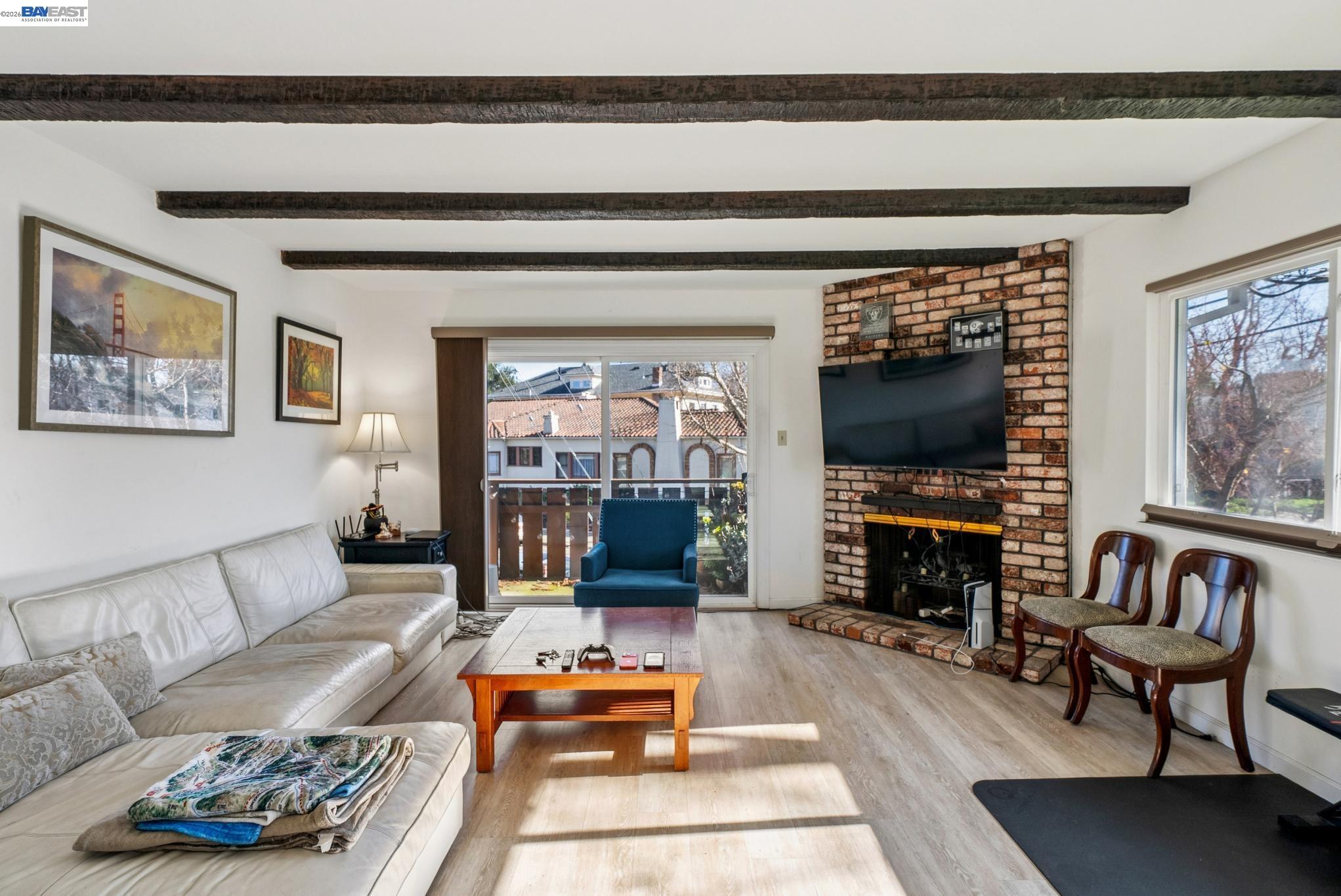 1401 Cottage Street, Unit D Alameda, CA 94501 - Photo 6 of 25 a living room with furniture and a flat screen tv