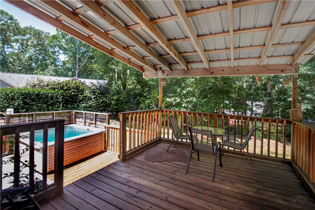 106 Farmgate Road Pickens, SC 29671 - Photo 4 of 38 Enjoy time enjoying the oasis in your back yard. Including a covered deck and firepit