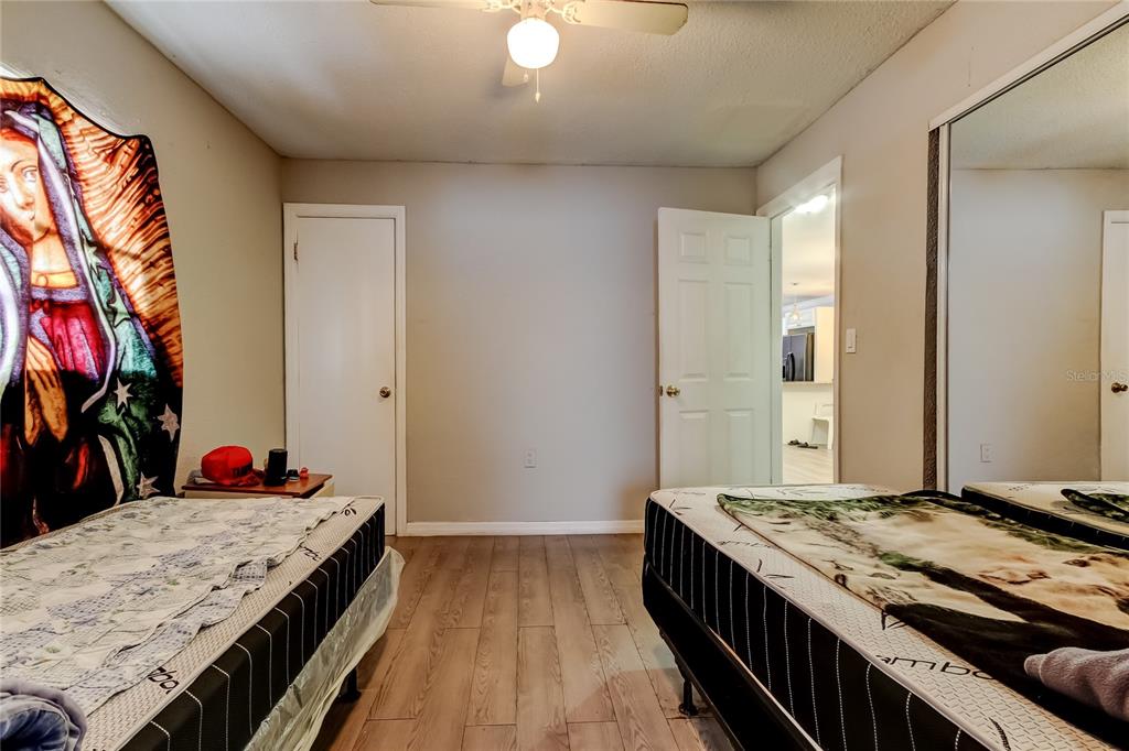 4532 Devonshire Road Tampa, FL 33634 - Photo 27 of 37 a kitchen with a stove and a wooden floor