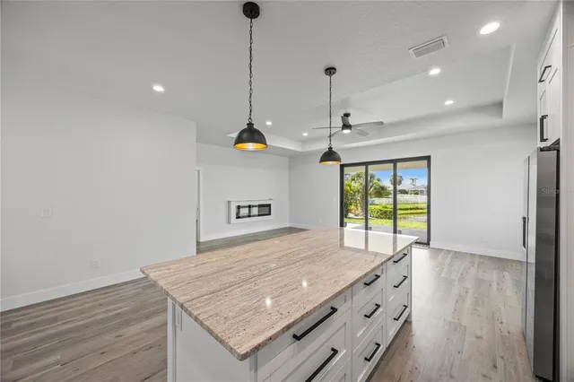 a living room with hard wood flooring and furniture