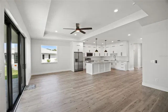 a view of kitchen with wooden floor and windows