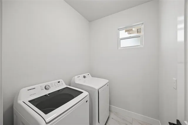 a utility room with dryer and washer