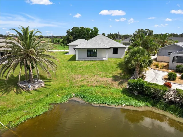 an aerial view of a house with garden space and outdoor seating