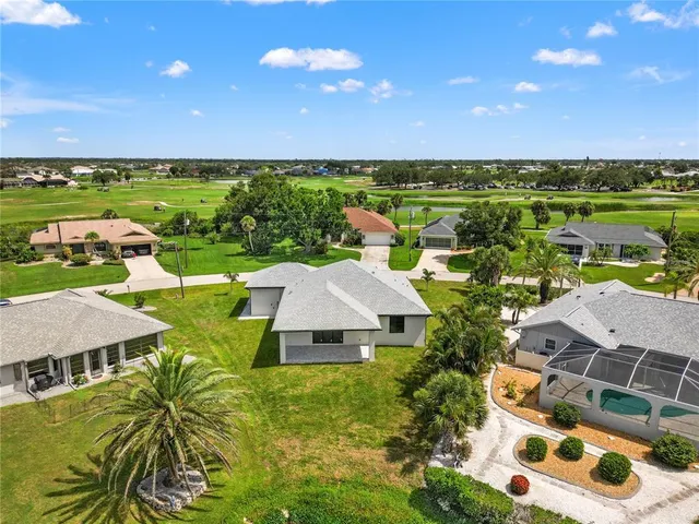 a view of a swimming pool with a yard