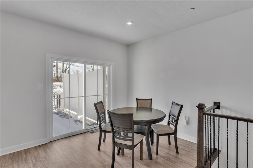 7406 Chestnut Way Gibsonia, PA 15044 - Photo 10 of 42 a view of a dining room with furniture and wooden floor