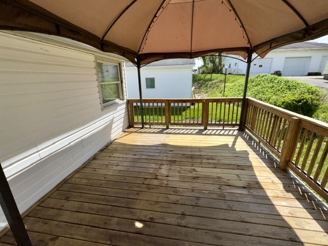 1701 West Jefferson Street Springfield, OH 45506 - Photo 13 of 18 Relax outdoors on this inviting deck, perfect for peaceful mornings or serene evenings.