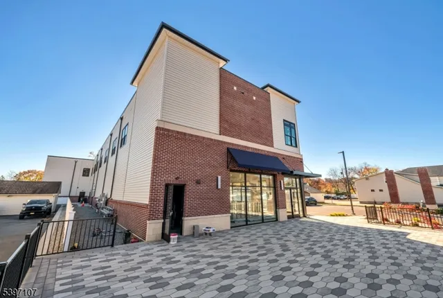 a view of a house with a barbeque