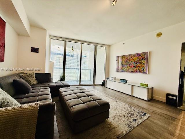 475 Brickell Avenue, Unit 4910 Miami, FL 33131 - Photo 12 of 42 a living room with furniture or couch and a window