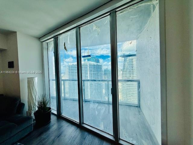 475 Brickell Avenue, Unit 4910 Miami, FL 33131 - Photo 14 of 42 a view of a glass door and wooden floor